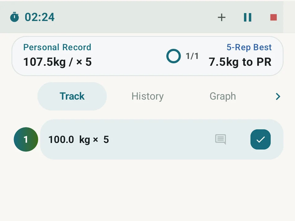 A completed squat set, the rest timer, and the previous five-rep best