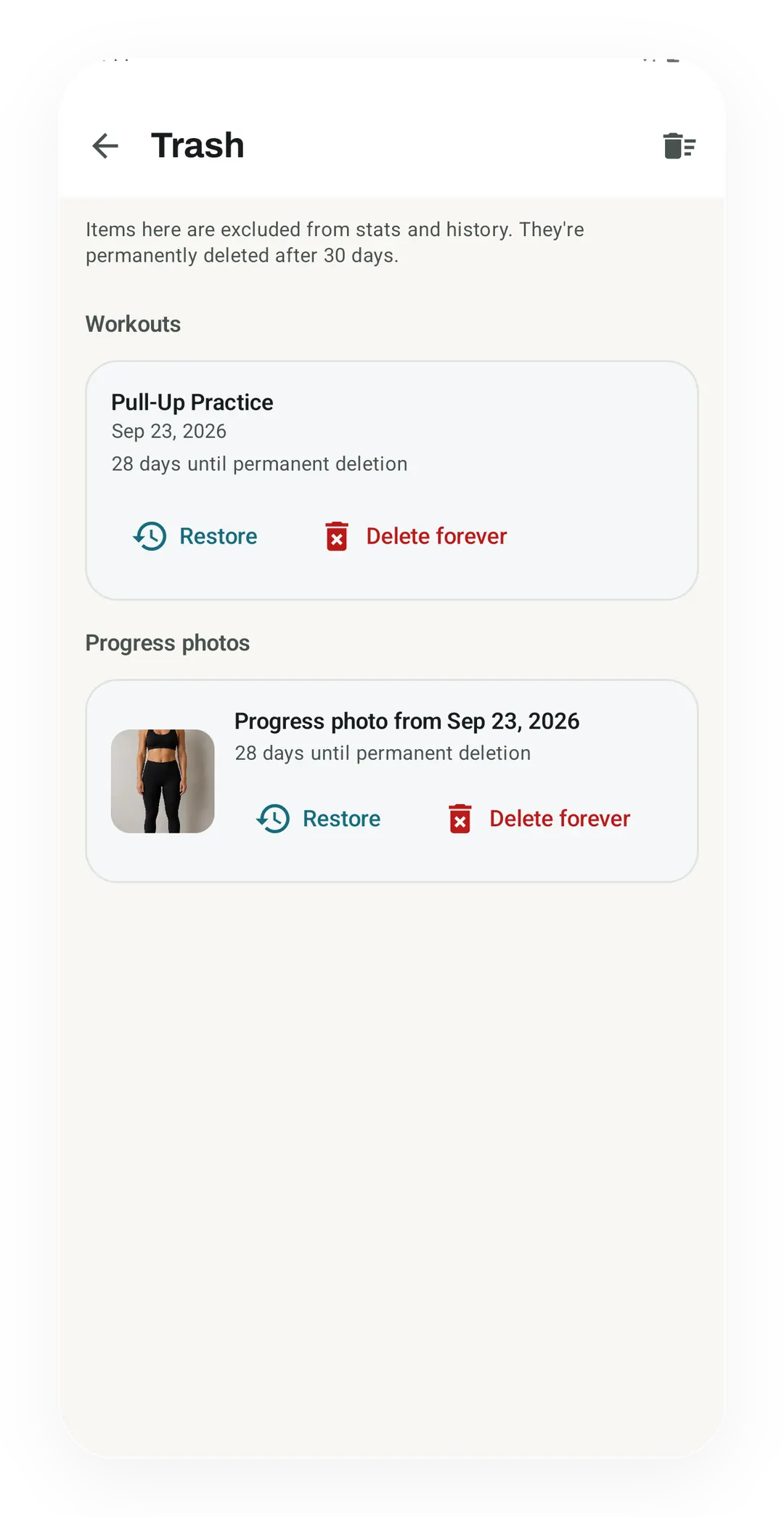 Trash screen with the Pull-Up Practice workout and a progress photo from Sep 23, 2026, each 28 days from deletion, with Restore and Delete forever